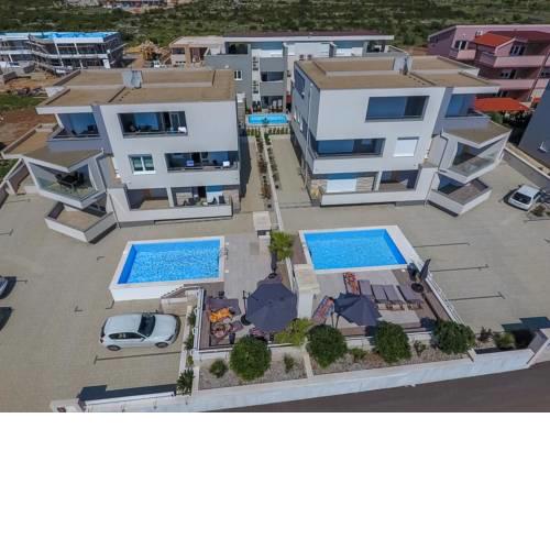 Apartments and rooms with a swimming pool Novalja, Pag - 17225