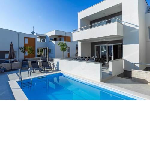 Apartments with a swimming pool Novalja, Pag - 17219