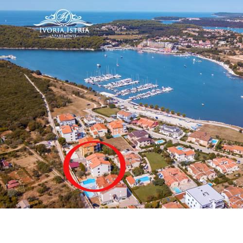 Ivoria Apartments with pool by the sea